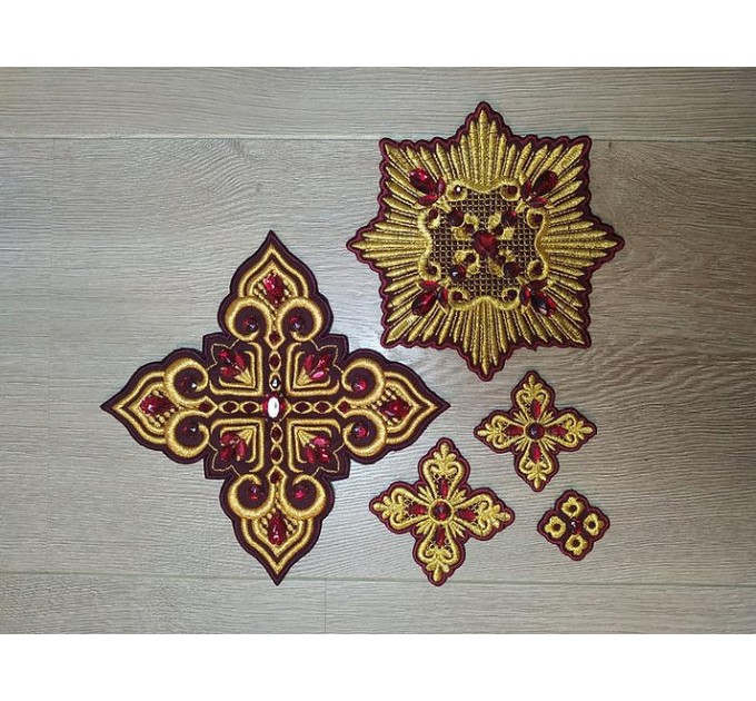 Set of 14 embroidered crosses with decorative stones