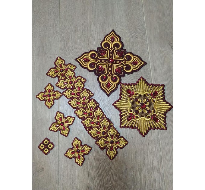 Set of 14 embroidered crosses with decorative stones