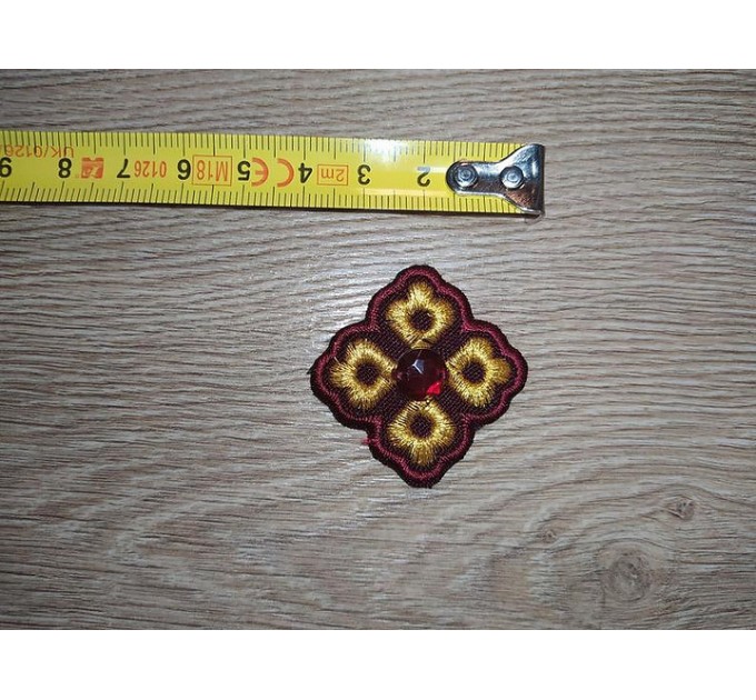 Set of 14 embroidered crosses with decorative stones